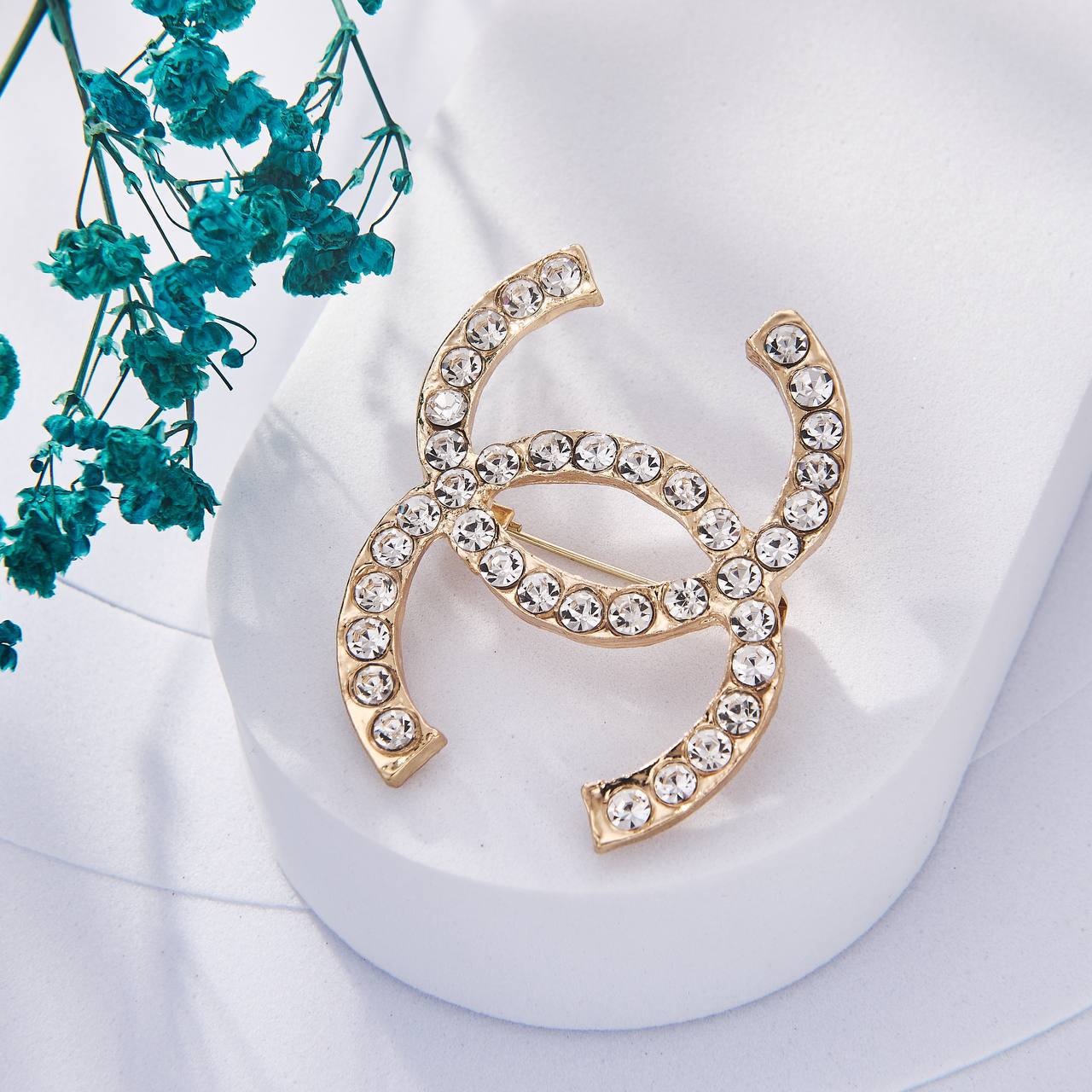 Une Selection de luxe de Broche Chanel Inoxydable