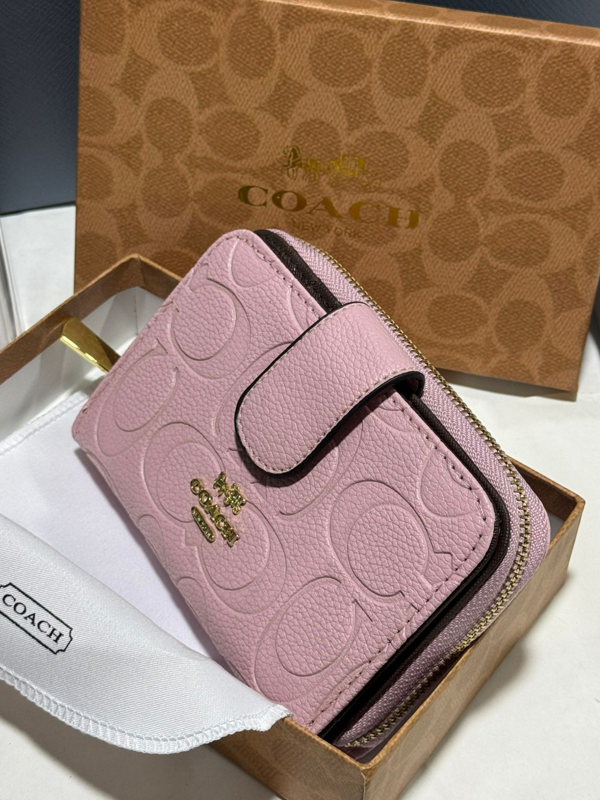 Porte feuille en Couleurs Coach