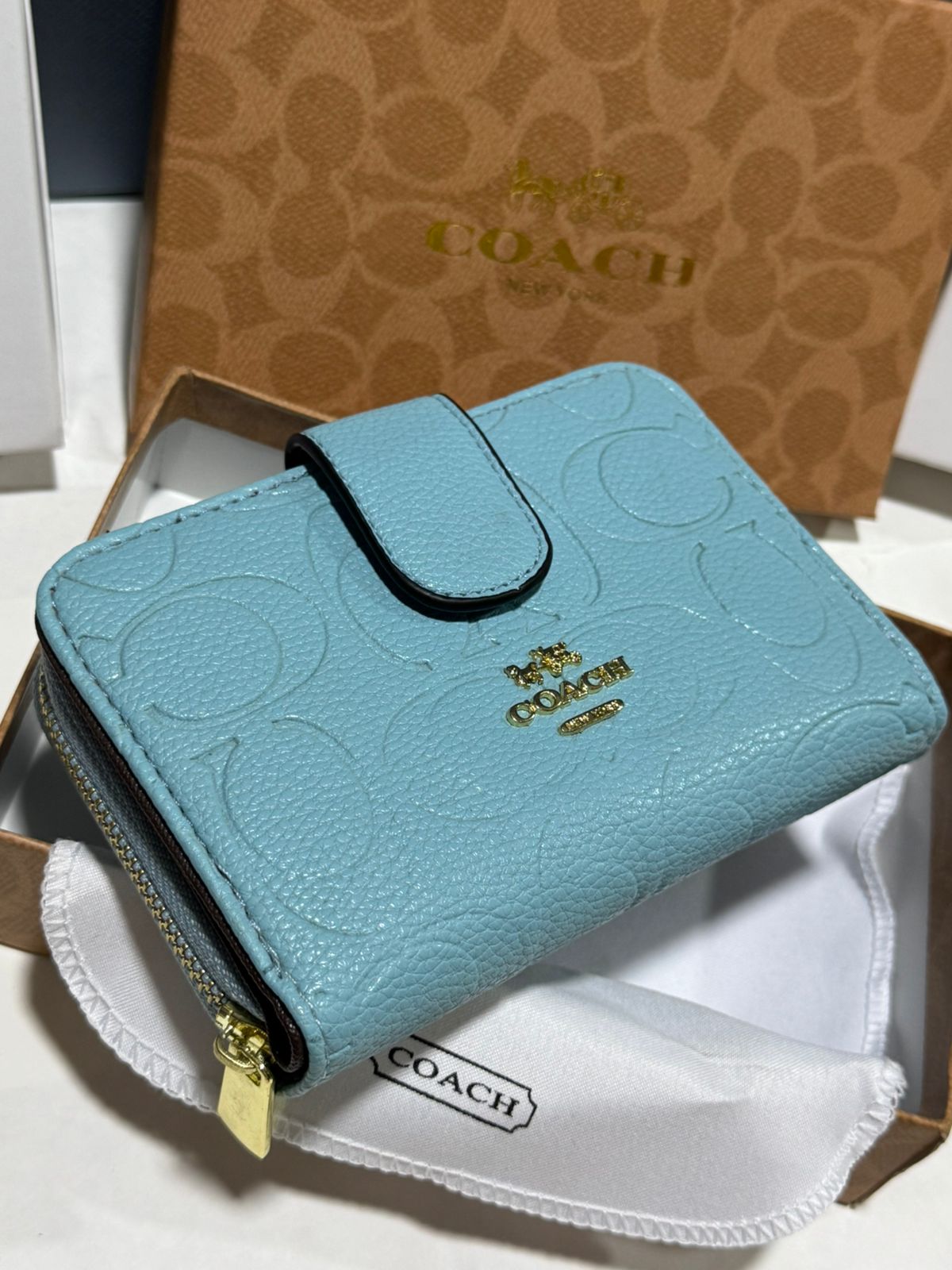 Porte feuille en Couleurs Coach