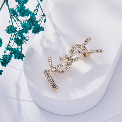 Broche Yves Saint Laurent Inoxydable