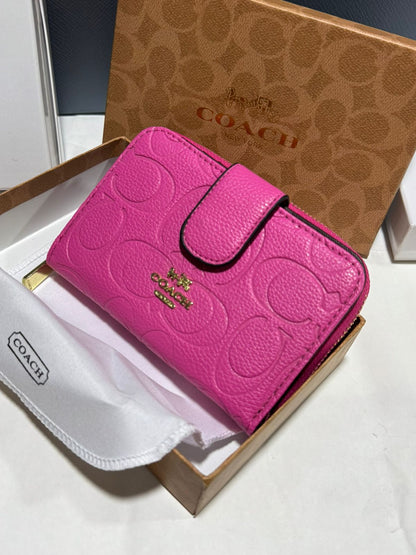 Porte feuille en Couleurs Coach