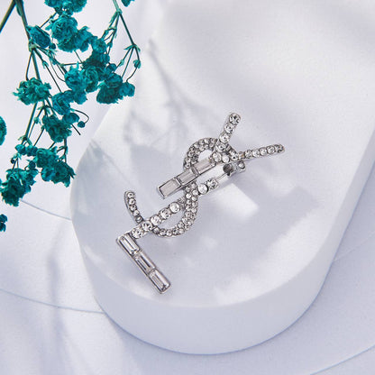 Broche Yves Saint Laurent Inoxydable