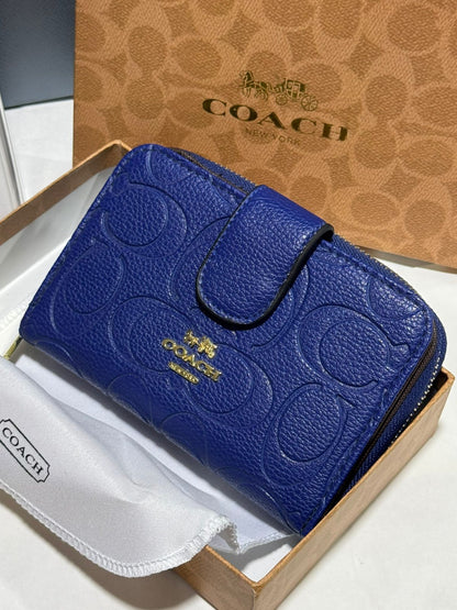 Porte feuille en Couleurs Coach