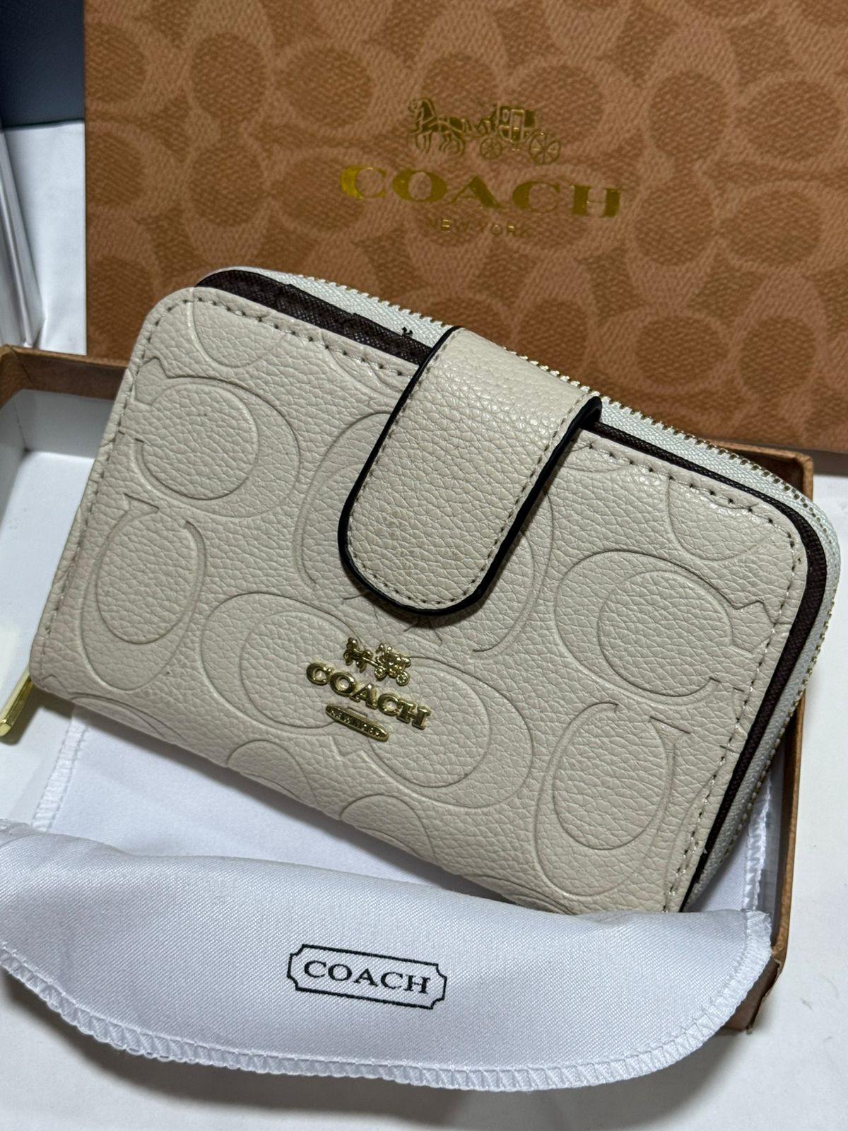 Porte feuille en Couleurs Coach