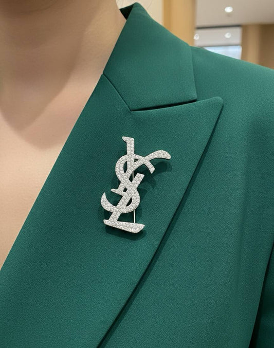 Broche Yves Saint Laurent Inoxydable